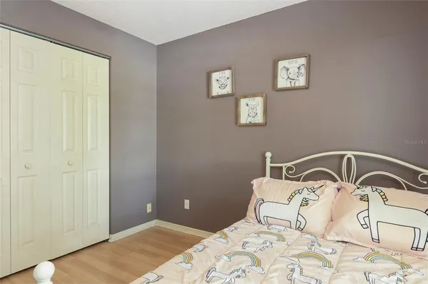 a bedroom with a bed and a sink