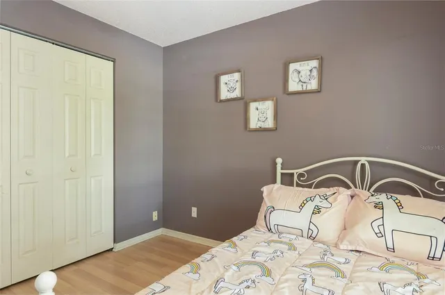 a bedroom with a bed and a sink