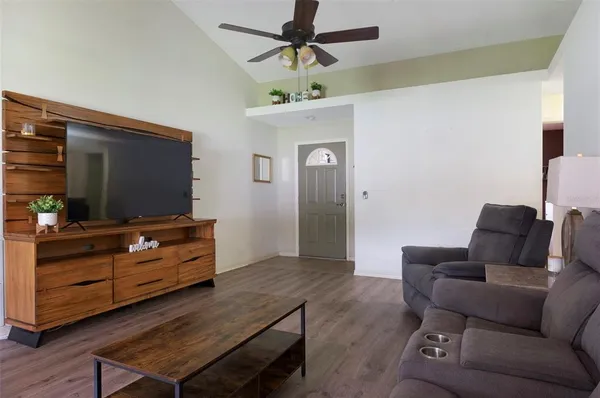 a living room with furniture and a flat screen tv