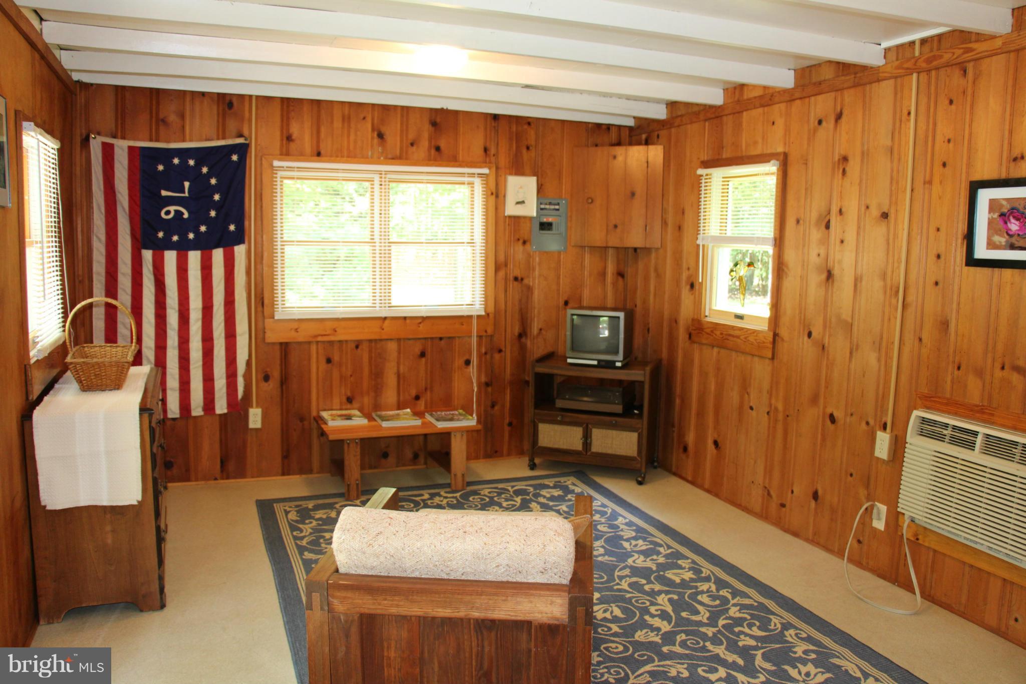8981 Bozman Neavitt Road St. Michaels, MD 21663 - Photo 22 of 30 a room with furniture a rug and a window