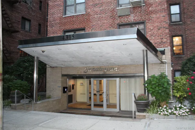 a front view of a building with garden