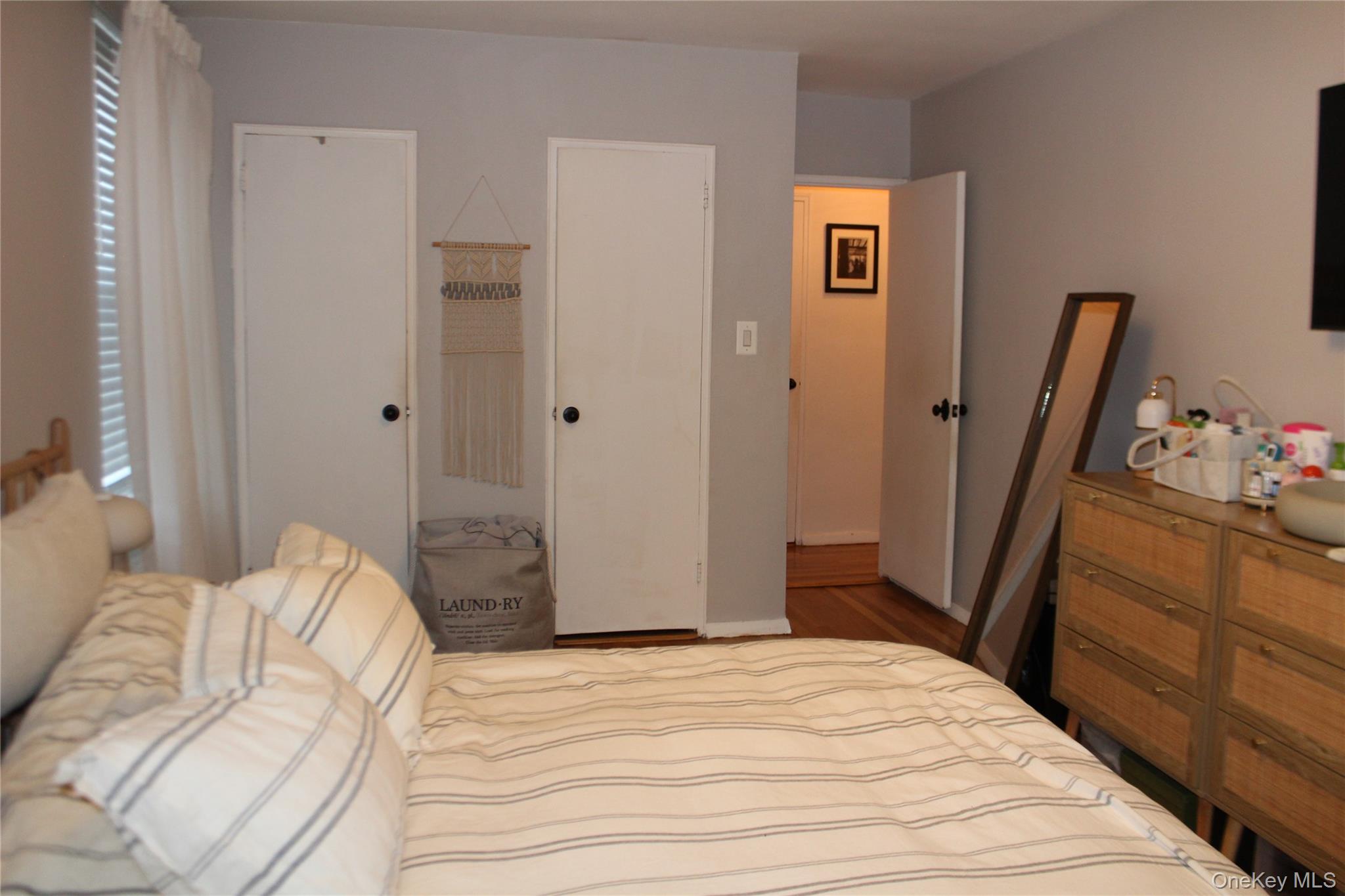 4315 Webster Avenue, Unit 3B Bronx, NY 10470 - Photo 6 of 13 a bedroom with a bed and a dresser in it