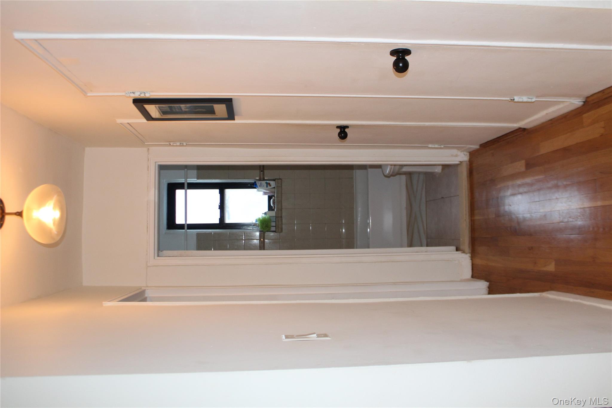 4315 Webster Avenue, Unit 3B Bronx, NY 10470 - Photo 9 of 13 a view of a hallway with wooden floor and closet