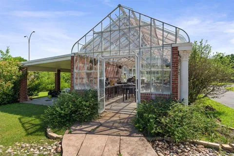 an aerial view of a house with a garden