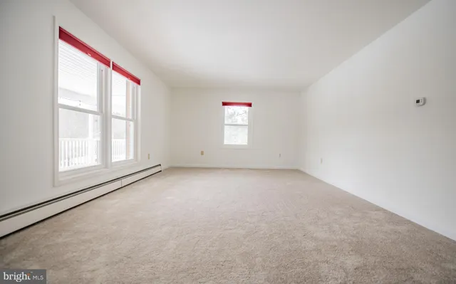 an empty room with windows