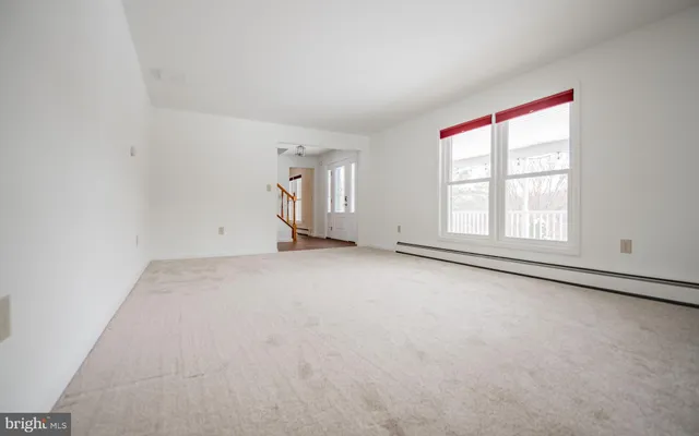 a view of an empty room with a window