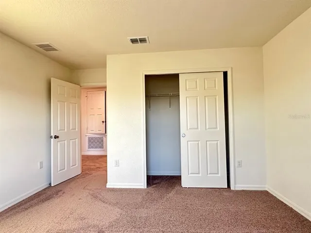 an empty room with closet