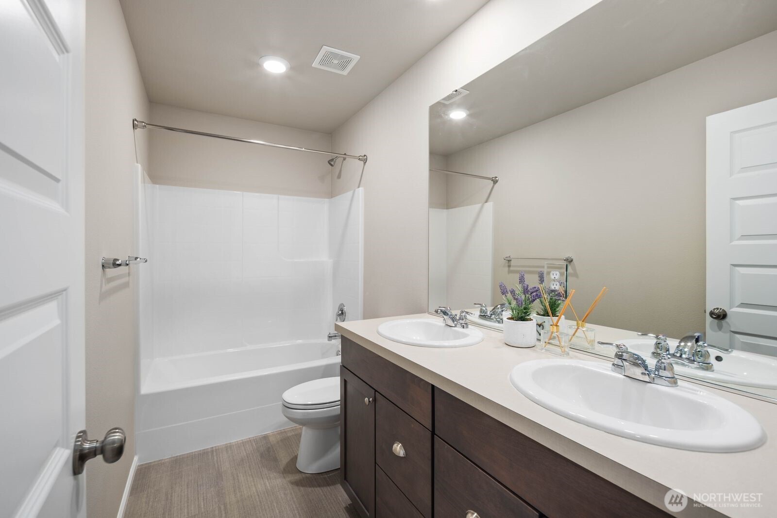 1214 Baker Hts Loop Bremerton, WA 98312 - Photo 26 of 38 a bathroom with a double vanity sink toilet mirror and shower
