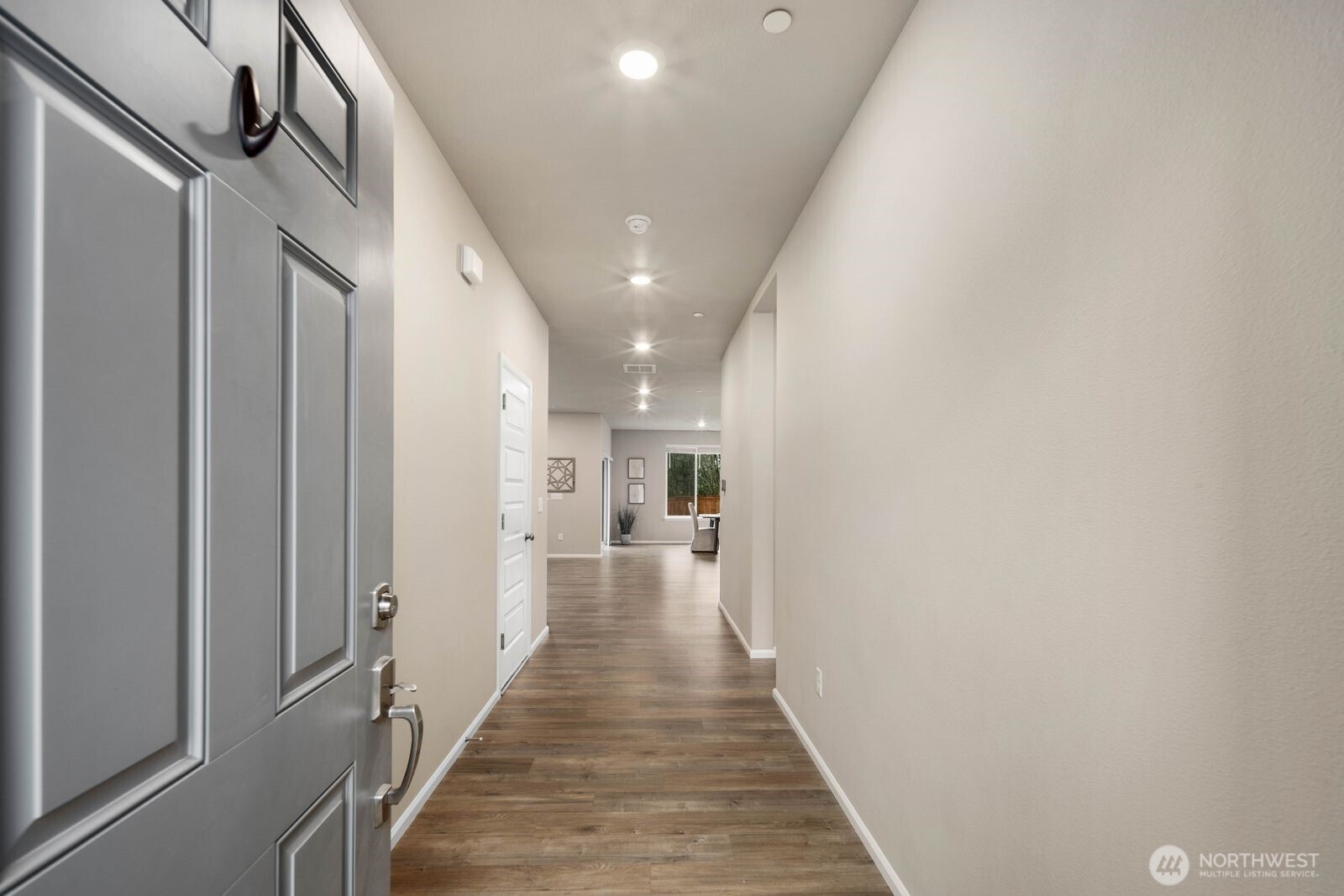 1214 Baker Hts Loop Bremerton, WA 98312 - Photo 3 of 38 a view of a hallway with wooden floor