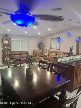 a view of a hallway with dining area