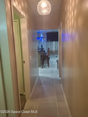a bathroom with a granite countertop sink a mirror and shower