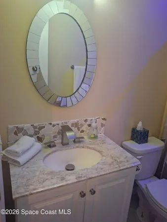 a bath tub sitting next to a shower