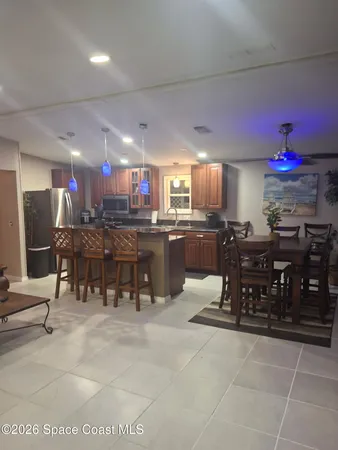 a kitchen with a stove and a refrigerator