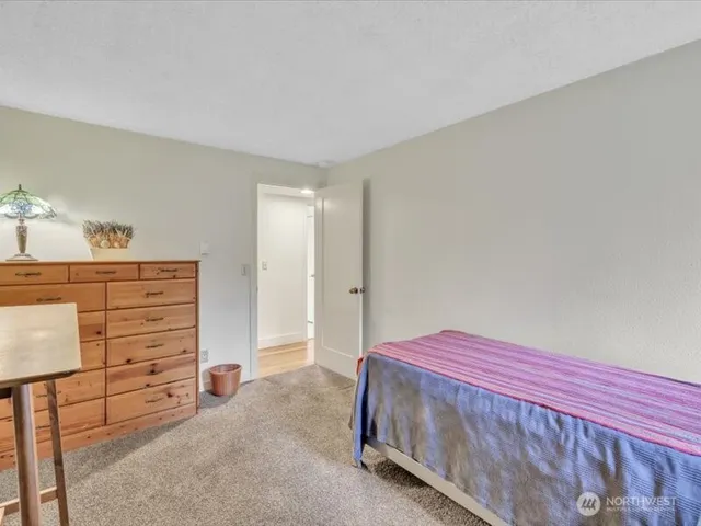 a bedroom with a bed and a cabinets