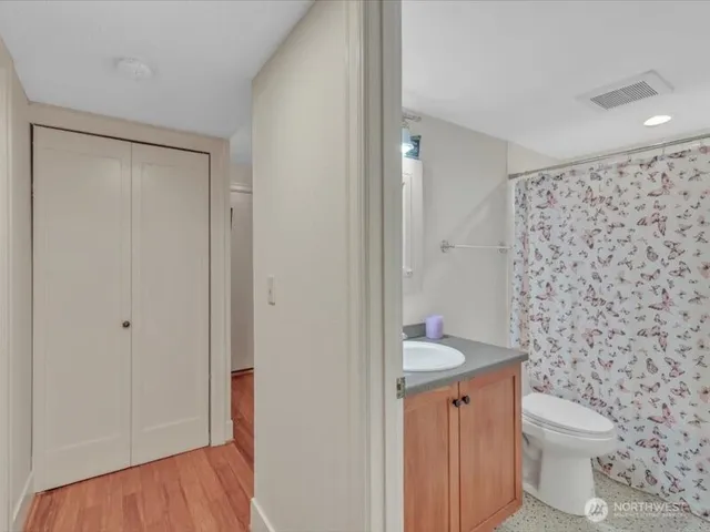 a bathroom with a toilet and a shower