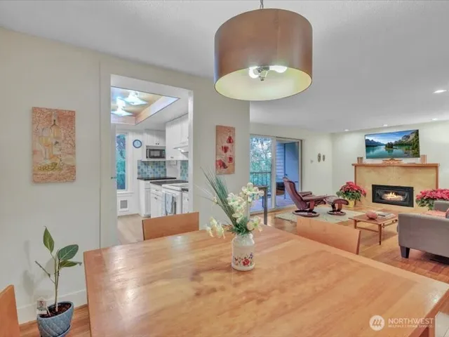 a living room with furniture potted plant and a fireplace