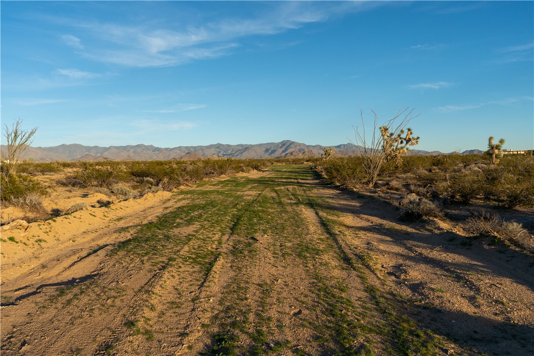 2.1 acre graded lot with building plan and electricity to street.