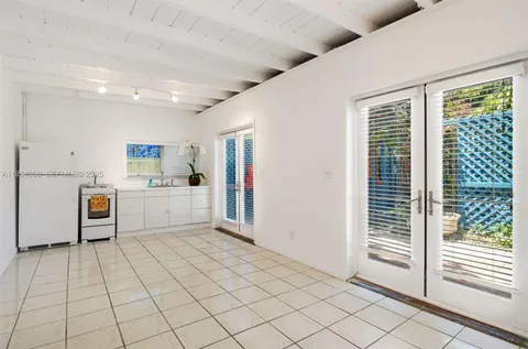 a view of a kitchen with microwave and cabinets