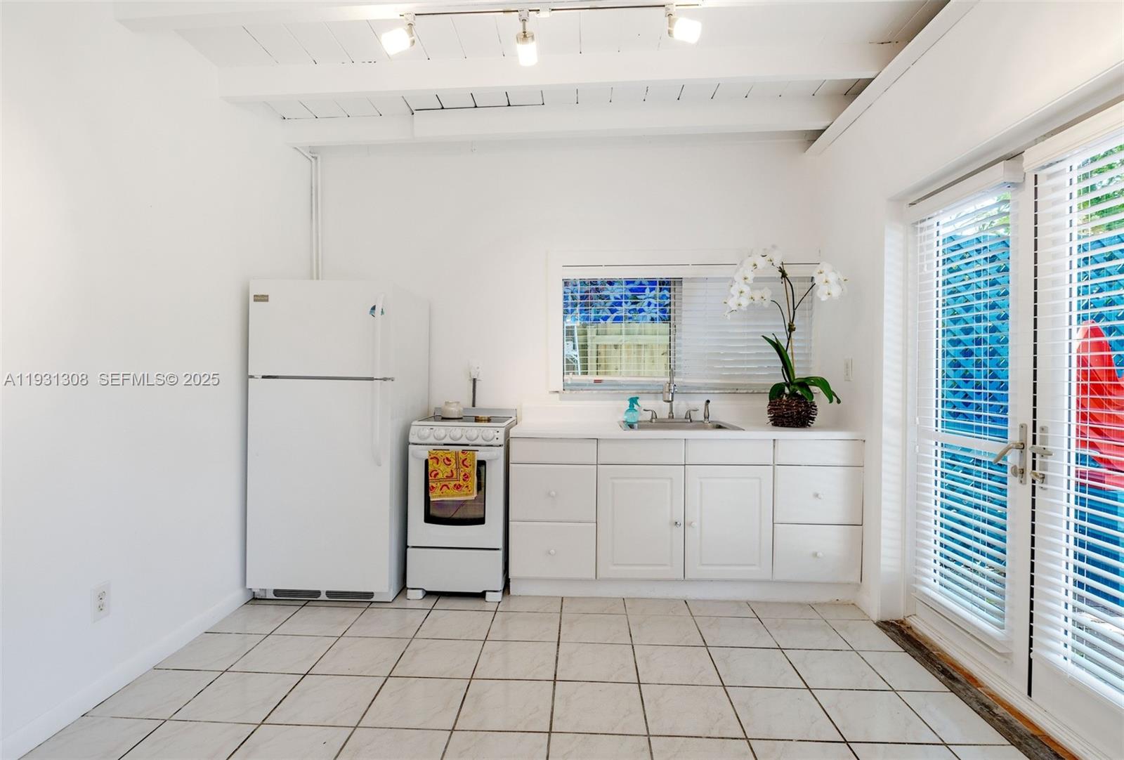 2330 Southwest 62nd Court Miami, FL 33155 - Photo 4 of 9 a utility room with cabinets washer and dryer