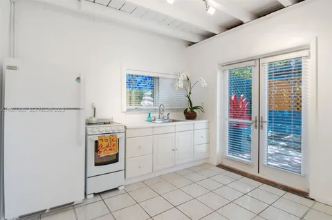 a room with mirror and window