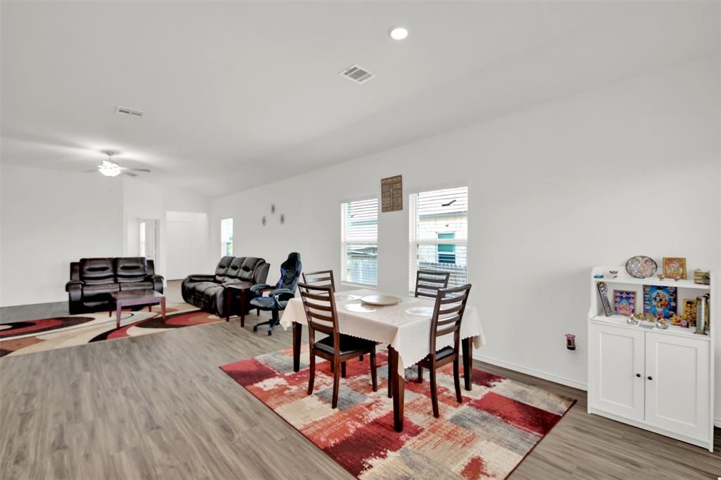 937 Mallow Road Leander, TX 78641 - Photo 11 of 30 a living room with furniture and wooden floor