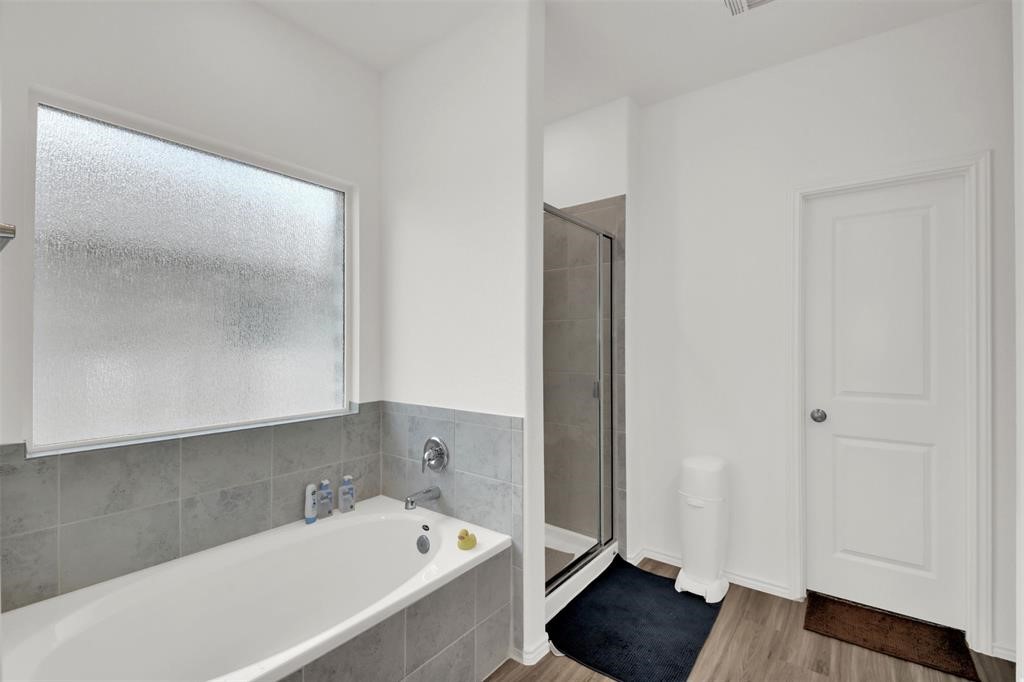 937 Mallow Road Leander, TX 78641 - Photo 20 of 30 a bathroom with a tub and shower