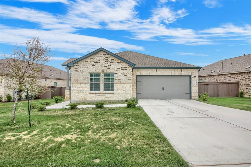 937 Mallow Road Leander, TX 78641 - Photo 2 of 30 a front view of a house with a yard