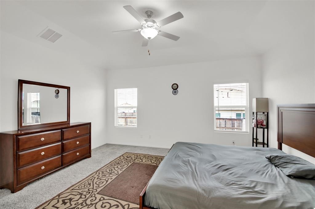 937 Mallow Road Leander, TX 78641 - Photo 27 of 30 a bedroom with a bed and a window