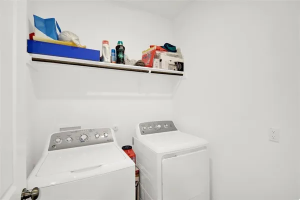 a utility room with dryer and washer