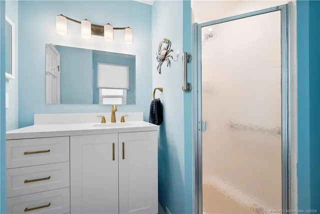 a bathroom with a sink and mirror