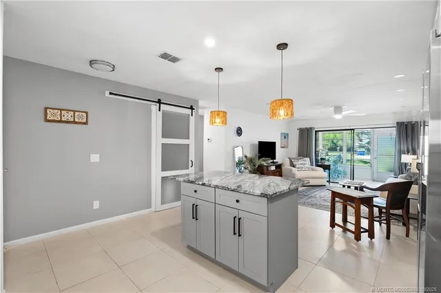 a kitchen with a cabinets and chairs
