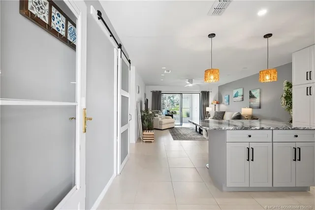 a very nice looking dining room with a chandelier