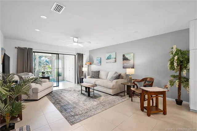 a living room with furniture rug and window
