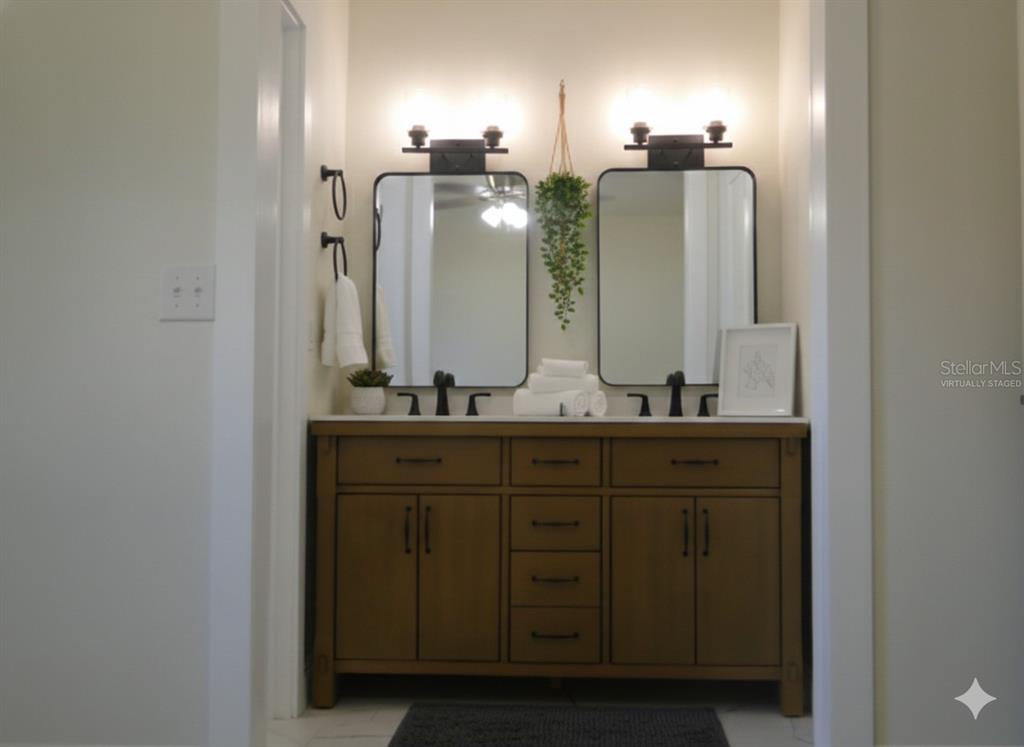 820 Dove Ridge Drive Lakeland, FL 33803 - Photo 12 of 21 a bathroom with double vanity and a mirror