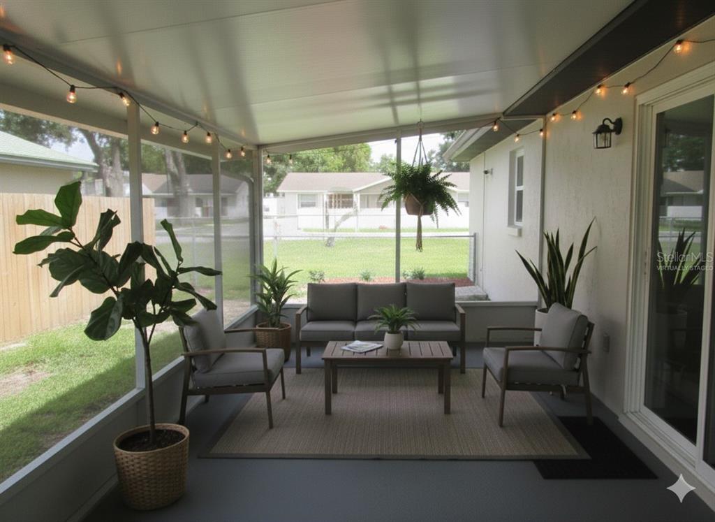 820 Dove Ridge Drive Lakeland, FL 33803 - Photo 18 of 21 a living room with patio furniture and a potted plant