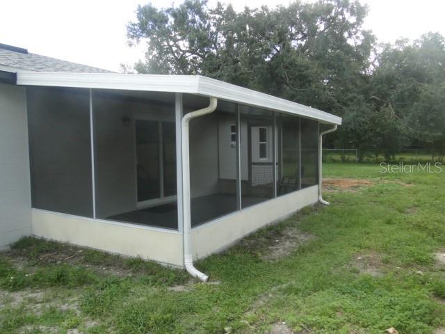820 Dove Ridge Drive Lakeland, FL 33803 - Photo 19 of 21 a backyard of a house with lots of green space