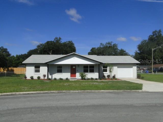 820 Dove Ridge Drive Lakeland, FL 33803 - Photo 2 of 21 a front view of a house with a garden