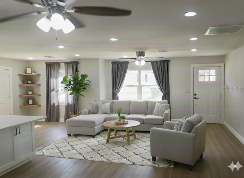 820 Dove Ridge Drive Lakeland, FL 33803 - Photo 3 of 21 a living room with furniture and a large window