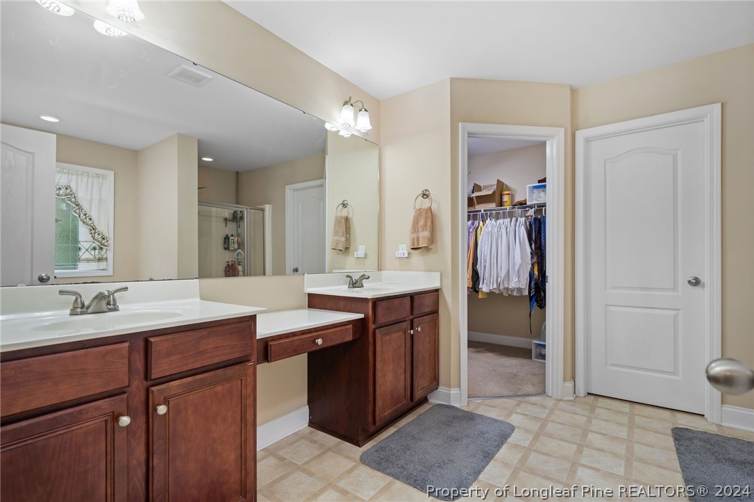 5078 Aberdeen Road Raeford, NC 28376 - Photo 23 of 46 a spacious bathroom with a sink and a mirror