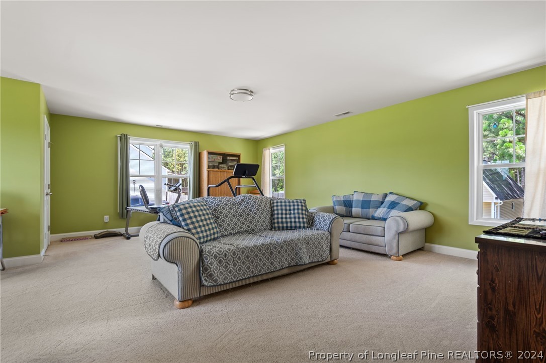 5078 Aberdeen Road Raeford, NC 28376 - Photo 26 of 46 a living room with furniture and a large window