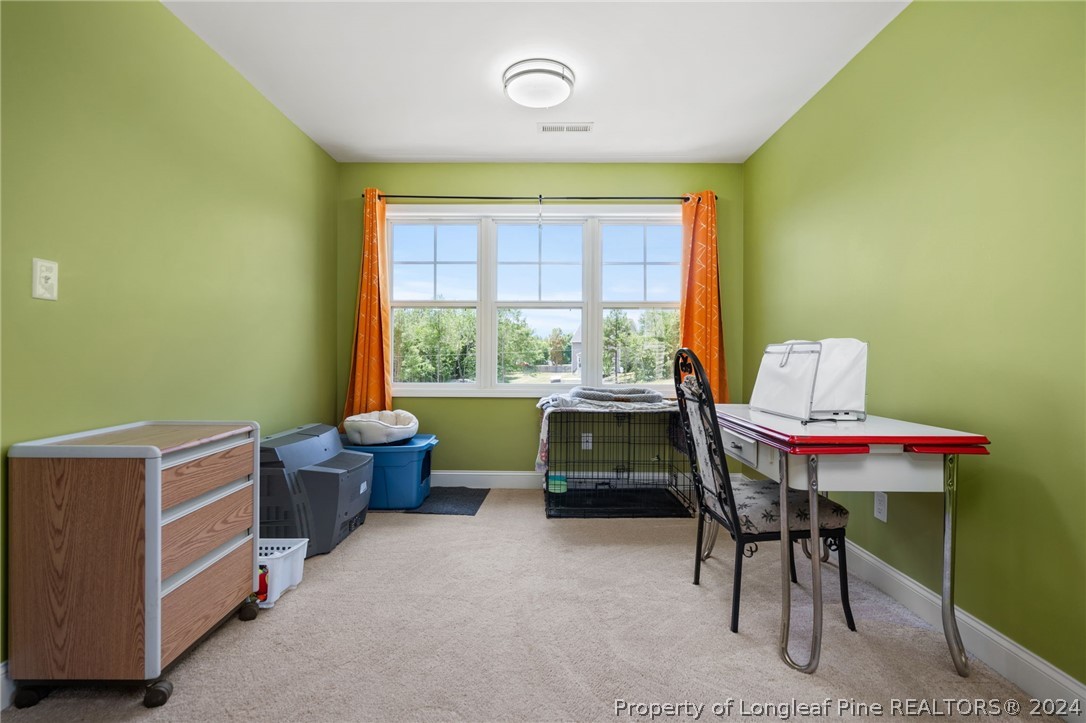 5078 Aberdeen Road Raeford, NC 28376 - Photo 28 of 46 a living room with furniture and a window