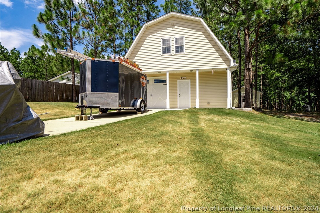 5078 Aberdeen Road Raeford, NC 28376 - Photo 31 of 46 a view of a house with a yard and sitting area
