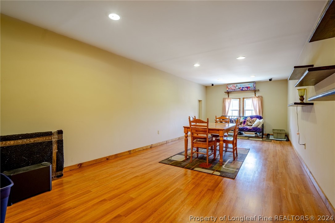 5078 Aberdeen Road Raeford, NC 28376 - Photo 32 of 46 a dining room with furniture and wooden floor