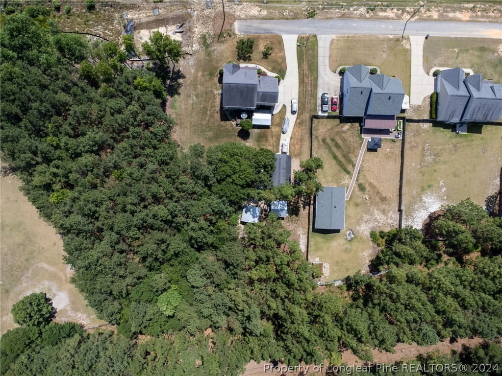 5078 Aberdeen Road Raeford, NC 28376 - Photo 44 of 46 an aerial view of a house with a yard basket ball court and outdoor seating