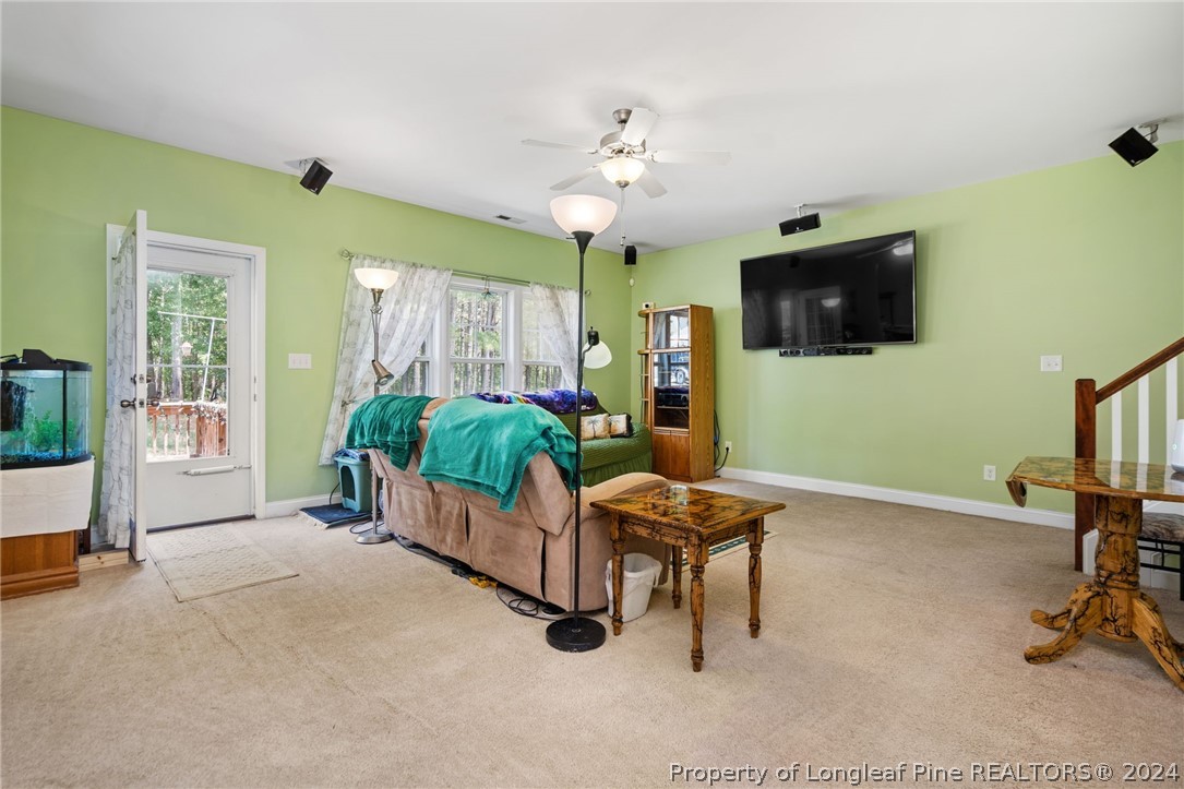 5078 Aberdeen Road Raeford, NC 28376 - Photo 6 of 46 a living room with furniture and a flat screen tv