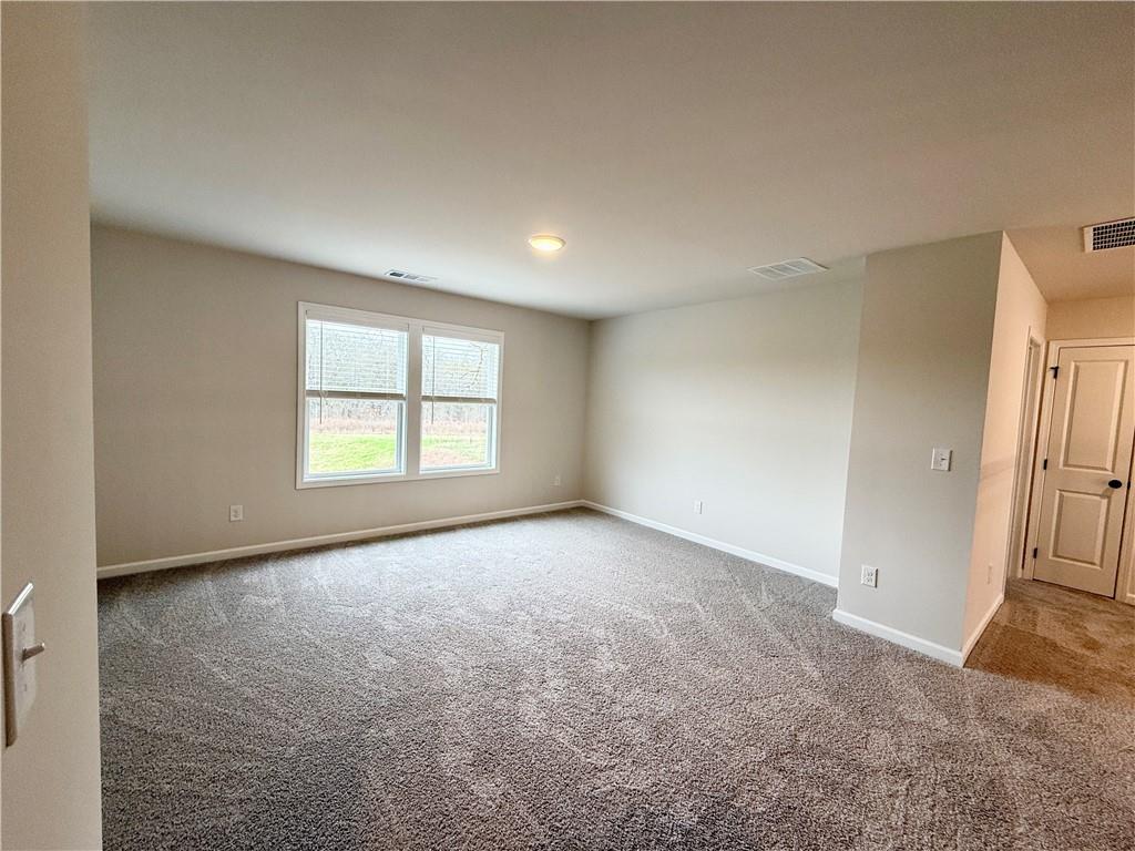 2506 Sunny Hill Road Buford, GA 30519 - Photo 14 of 25 an empty room with windows