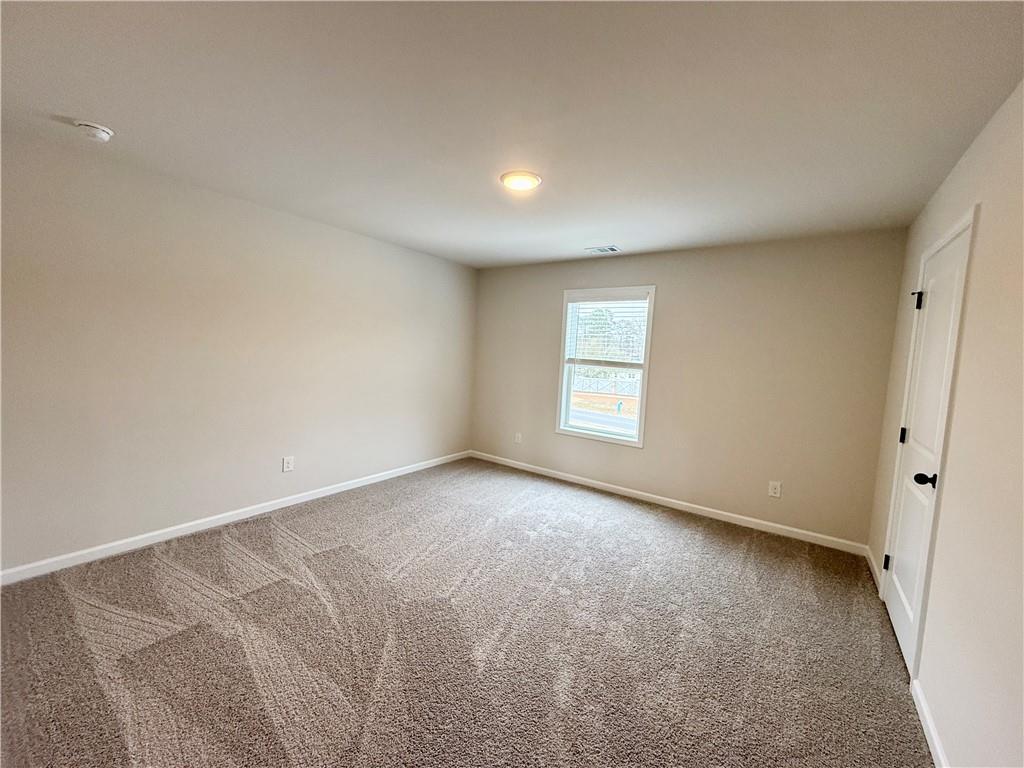 2506 Sunny Hill Road Buford, GA 30519 - Photo 19 of 25 an empty room with a window