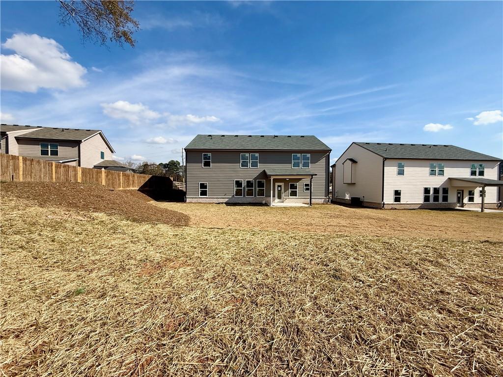2506 Sunny Hill Road Buford, GA 30519 - Photo 25 of 25 a front view of a house with a yard
