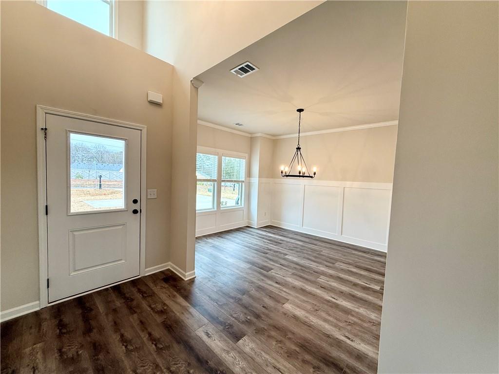 2506 Sunny Hill Road Buford, GA 30519 - Photo 5 of 25 a view of a room with wooden floor and window