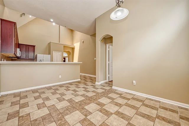 a view of a kitchen with a sink and cabinets